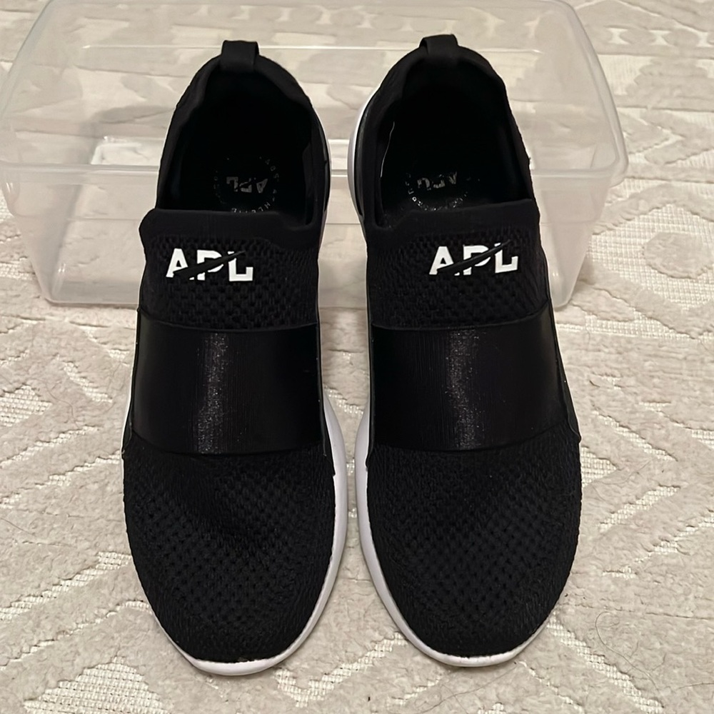APL, size 7 slip on sneaker. Black. Lightly used.